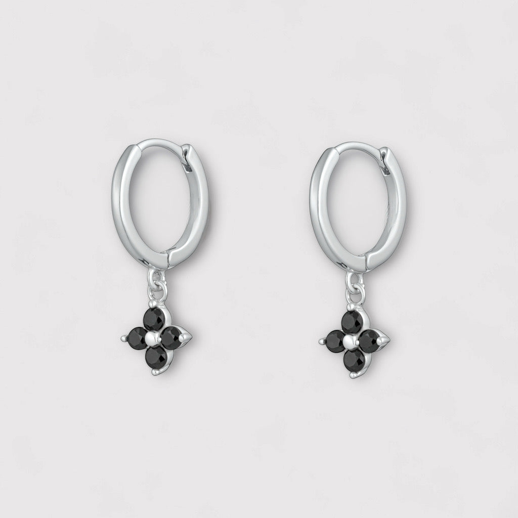 Model wearing PaulaB sterling silver rhodium hoop earrings with black onyx gemstone - Sydney jewellery Australia.