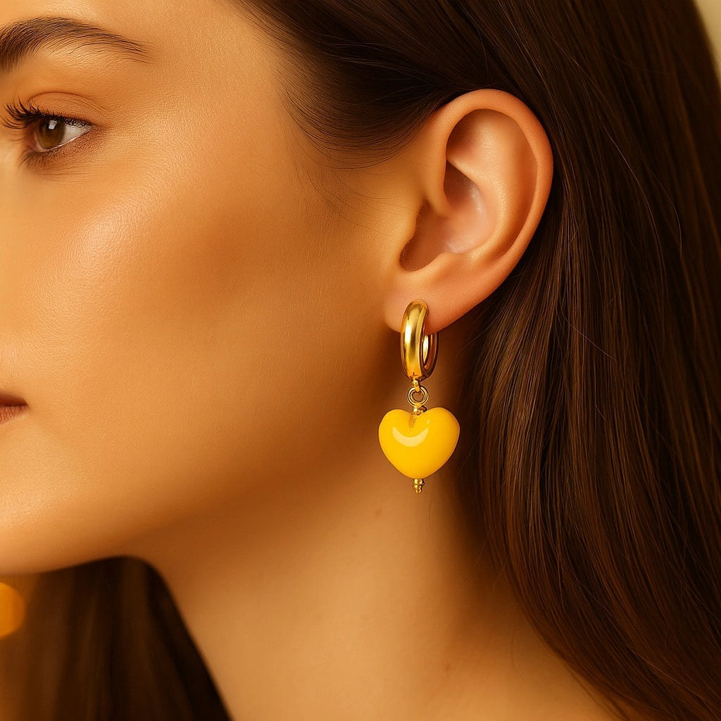 Model wearing PaulaB Sunshine Yellow Heart Earrings - 14k Gold Plated Hoops - Sydney Handmade Jewellery.