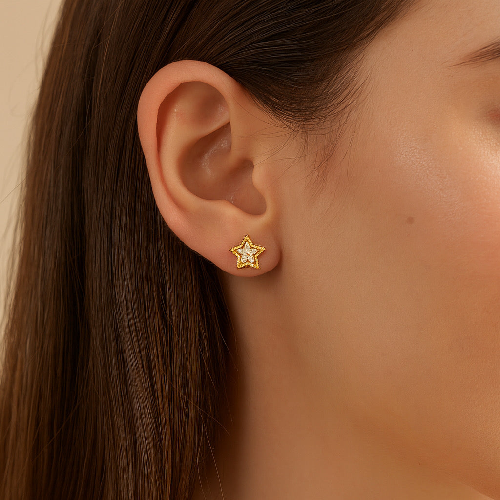 Model wearing PaulaB 14k gold plated star stud earrings, sterling silver with white cubic zirconia, Sydney.