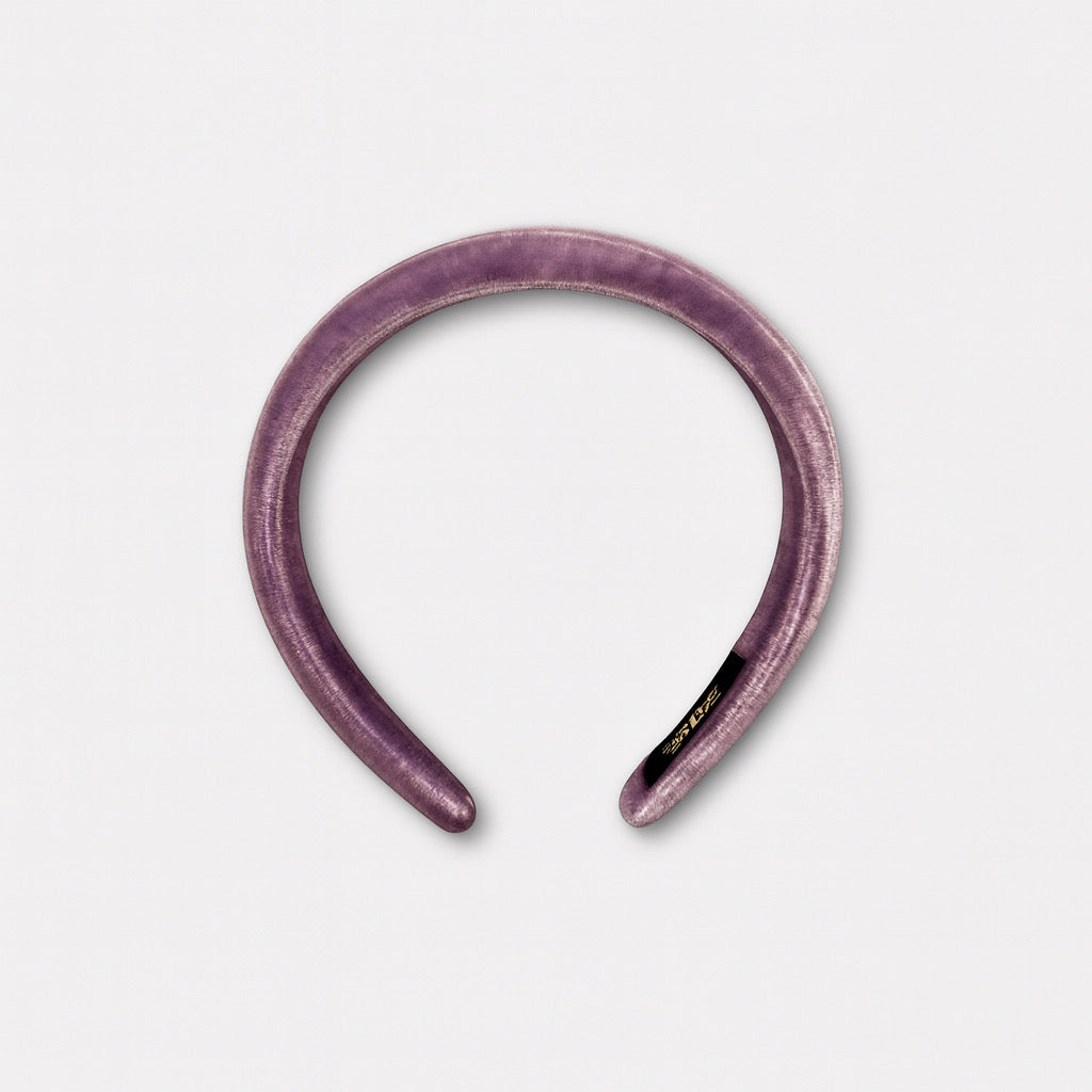 Top view of wide purple velvet headband luxury handmade hair accessory.