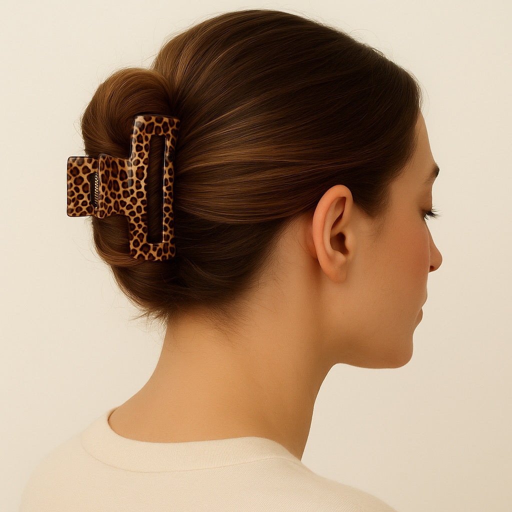 Model with brown French twist updo wearing Savannah Luxe animal print hair claw clip.