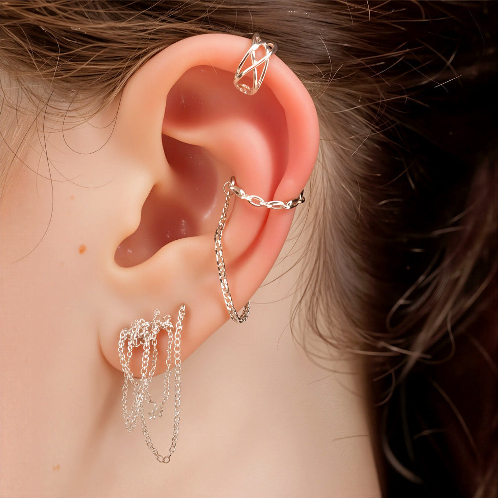 Layered ear stack featuring sterling silver cuff chain earrings with matching silver hoops
