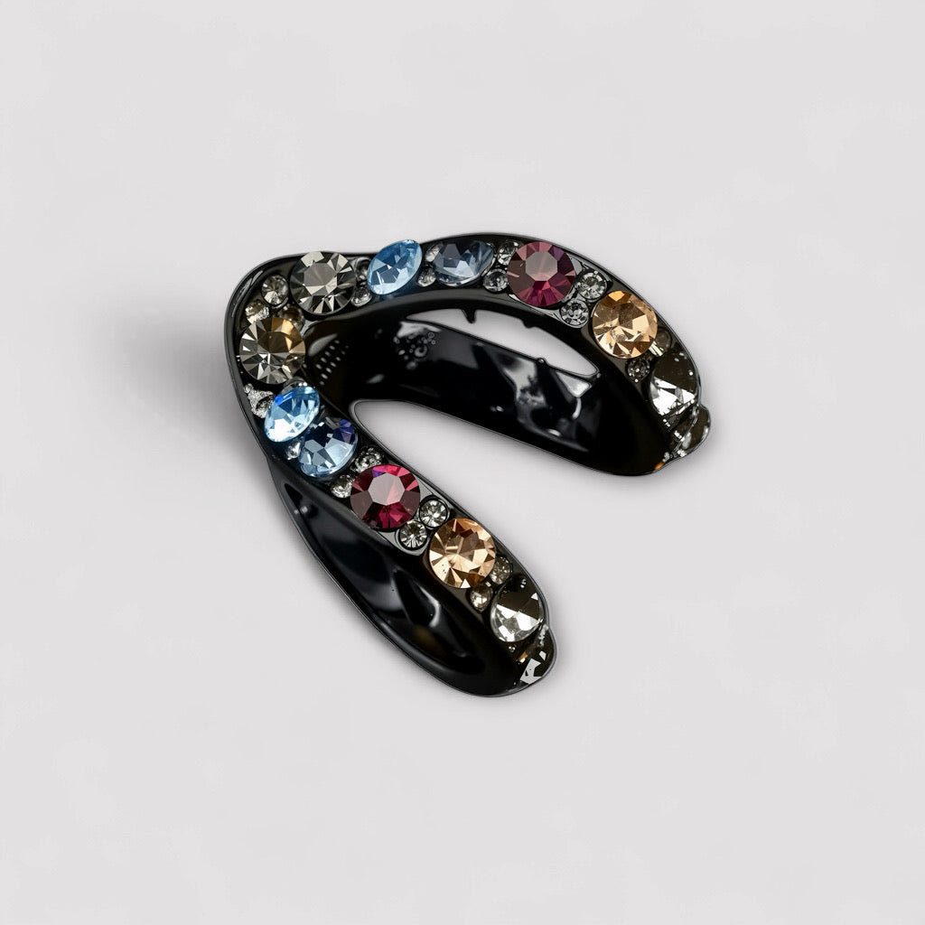 Close-up of twilight Spark multicolor rhinestone hair claw clip on white background.
