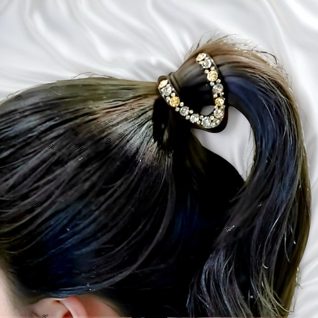 Model wearing the Twilight Sparkle hair claw clip in an elegant twisted updo.