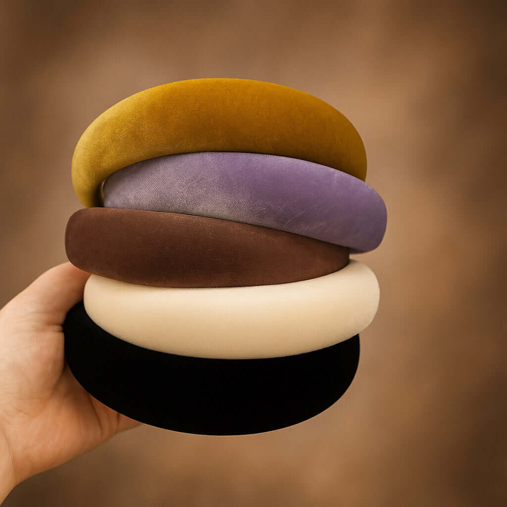 Stack of velvet padded headbands in cream, black, brown, purple and mustard PaulaB Jewellery & Accessories.