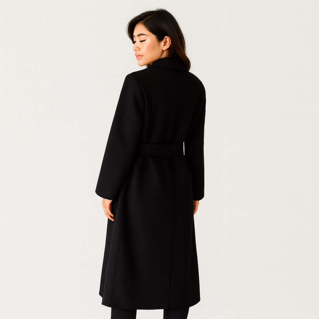 Back view of women's 100% wool belted cot in Midnight Black, long winter overcoat